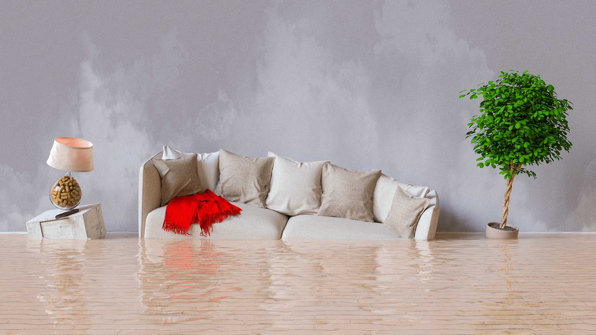Daños por agua tras una inundación en la casa con muebles flotando.
